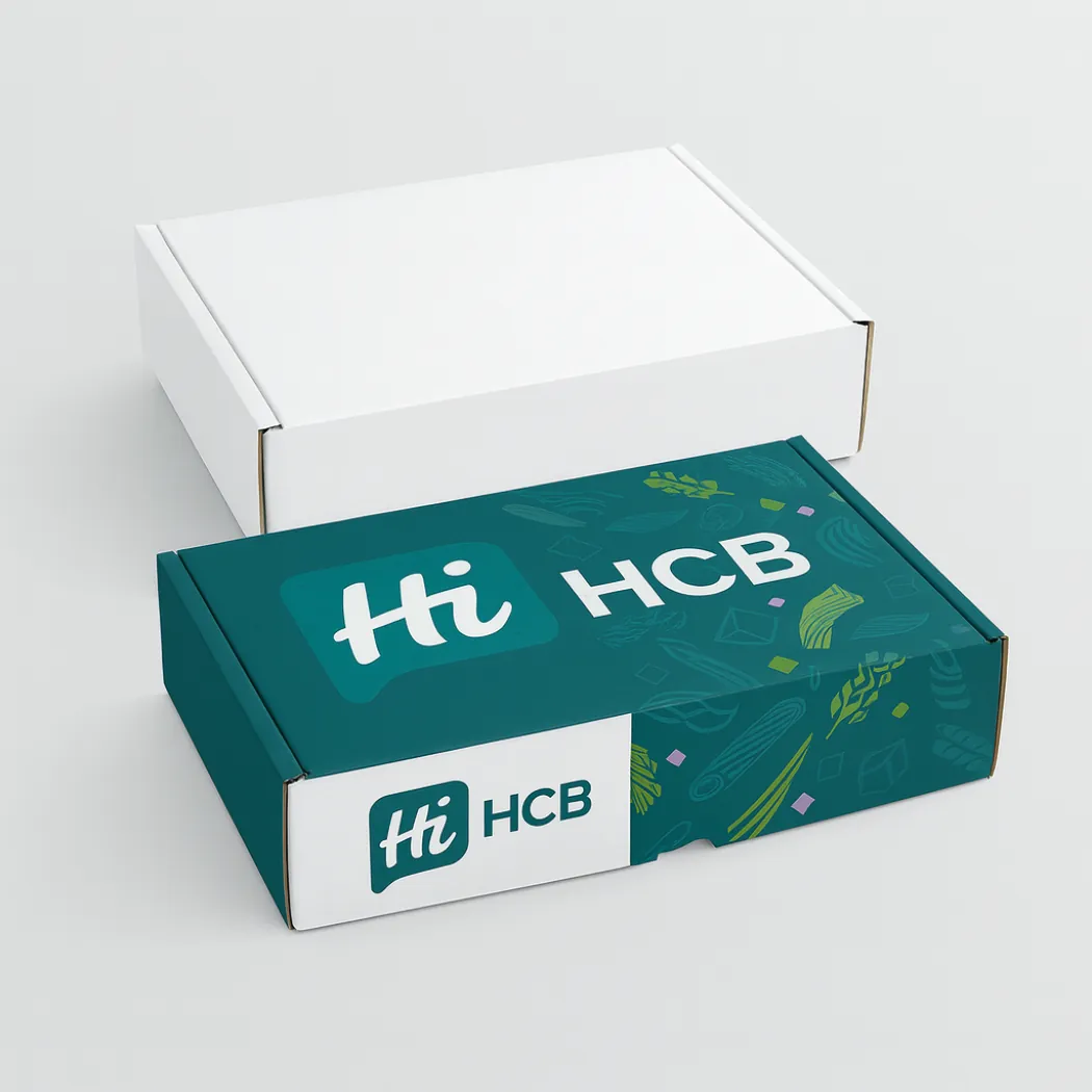 Two flat rectangular mailing boxes- one white and one teal with white branding and pasta-style patterns- class=